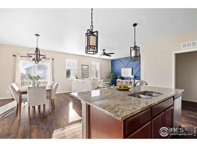 a kitchen with a table and chairs in it