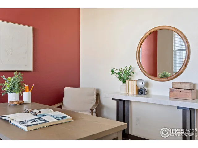 a bathroom with a sink a mirror and a potted plant