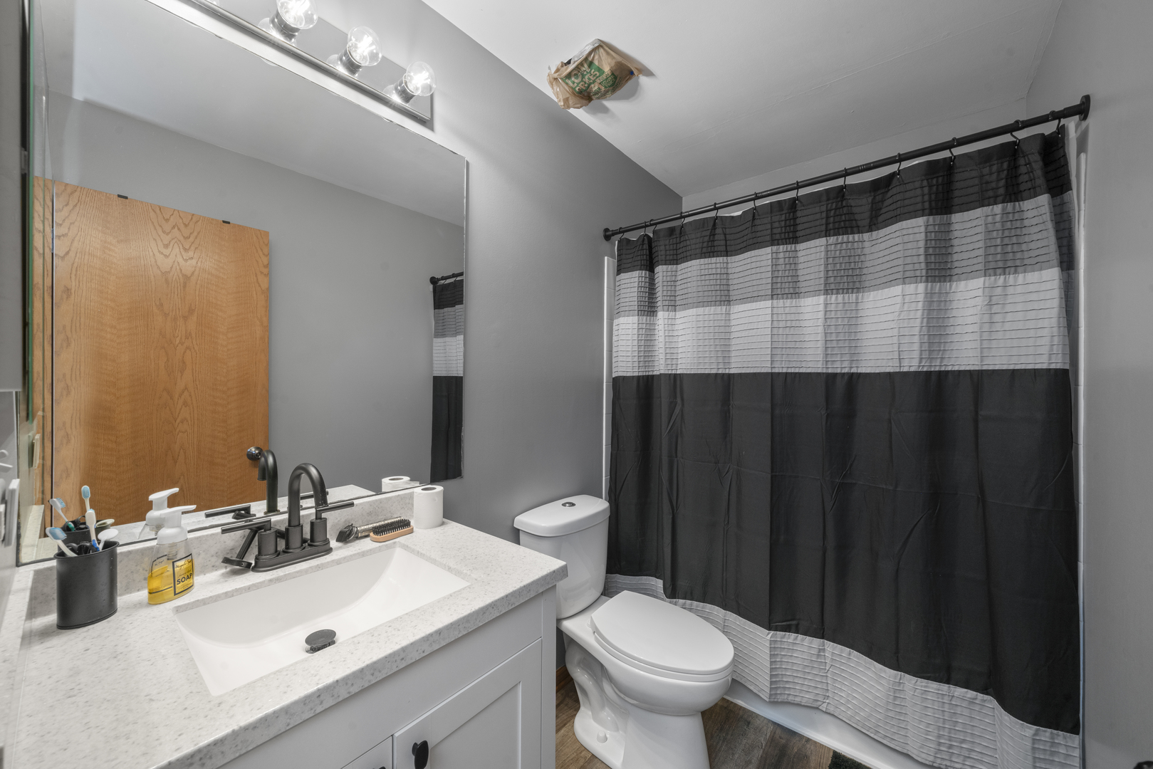 3505 Bailey Street Plano, IL 60545 - Photo 26 of 31 a bathroom with a sink and a mirror
