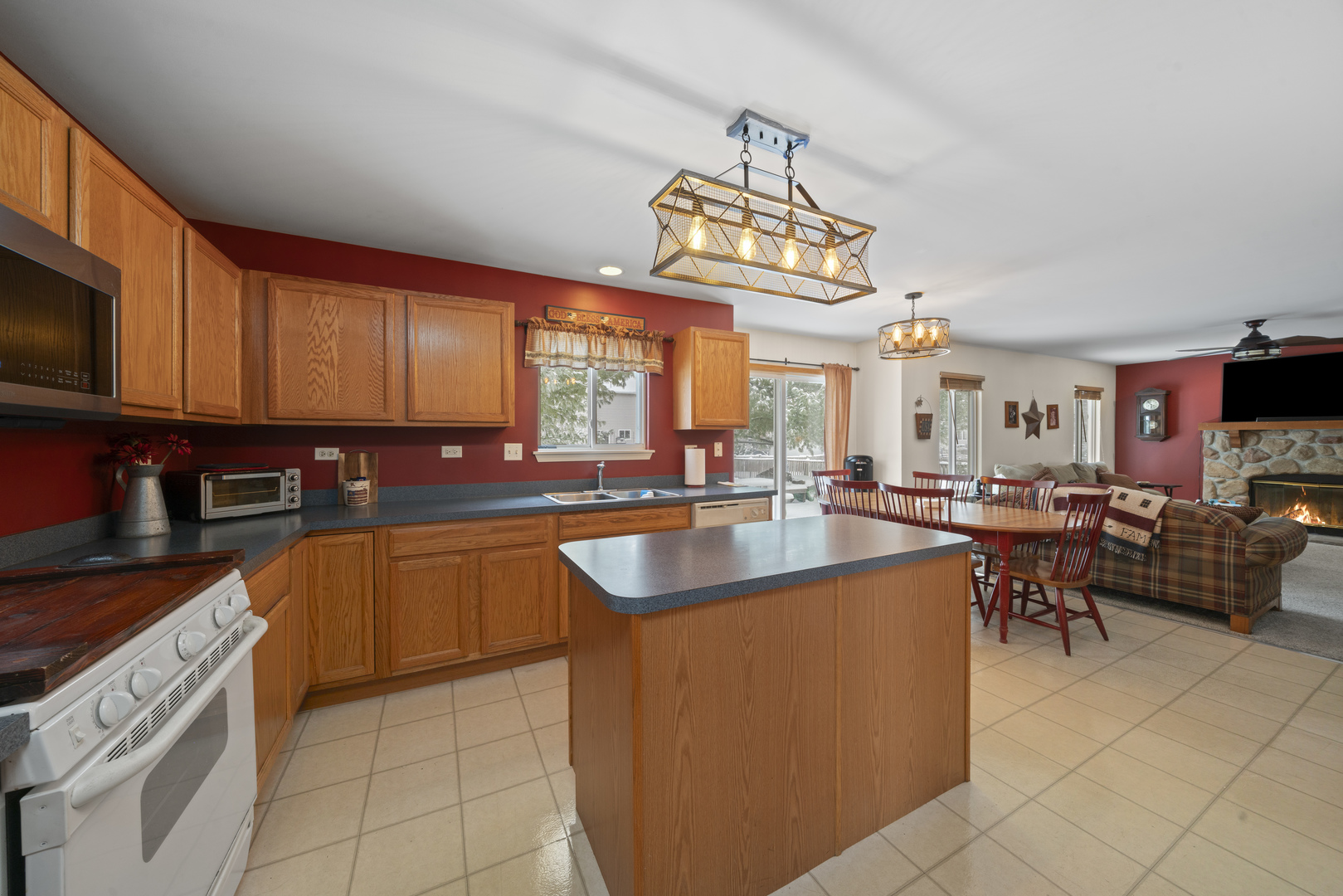 3505 Bailey Street Plano, IL 60545 - Photo 9 of 31 a kitchen with stainless steel appliances granite countertop a sink a stove top oven a counter space and cabinets