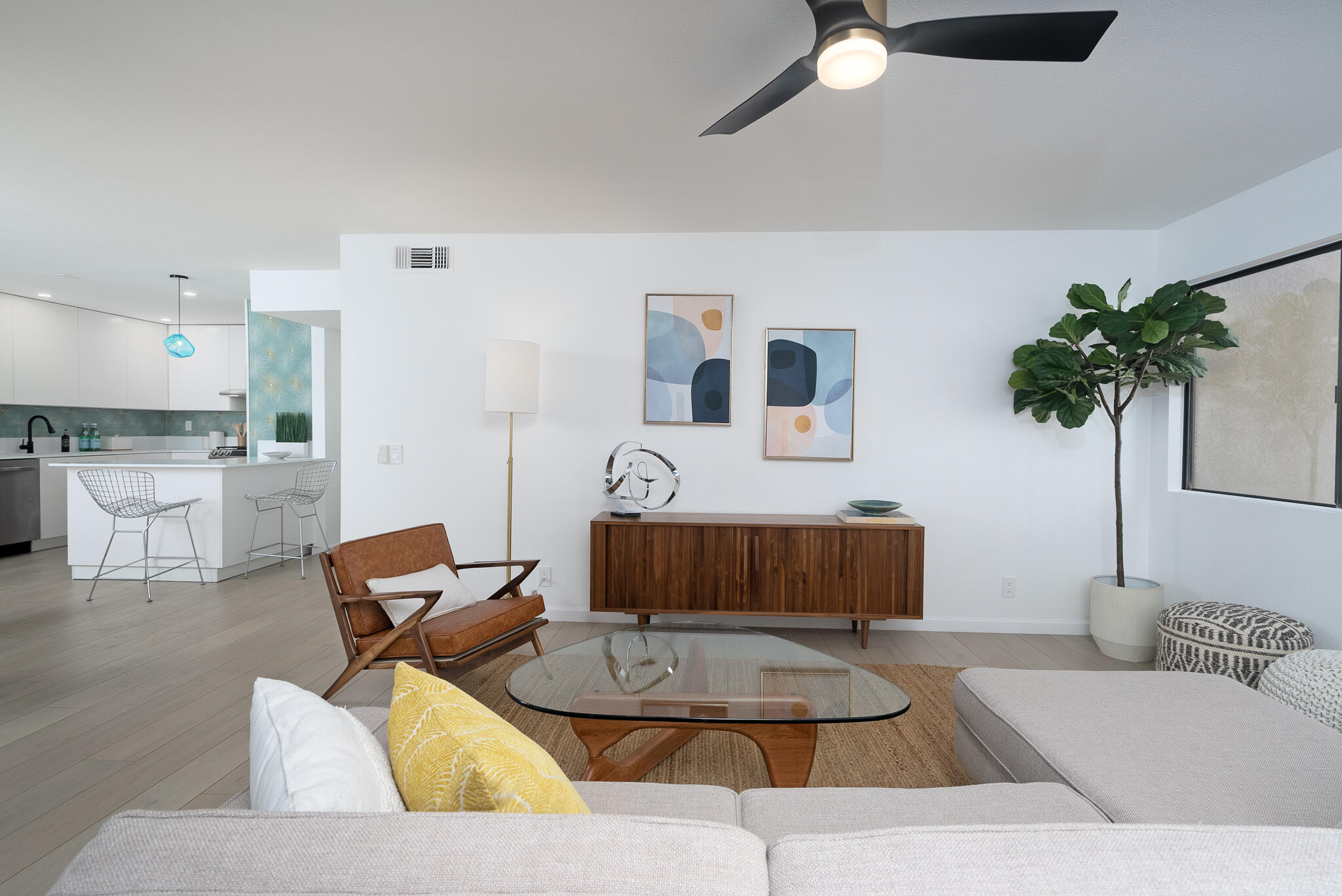 200 East Racquet Club Road, Unit 24 Palm Springs, CA 92262 - Photo 11 of 58 a living room with furniture and a potted plant