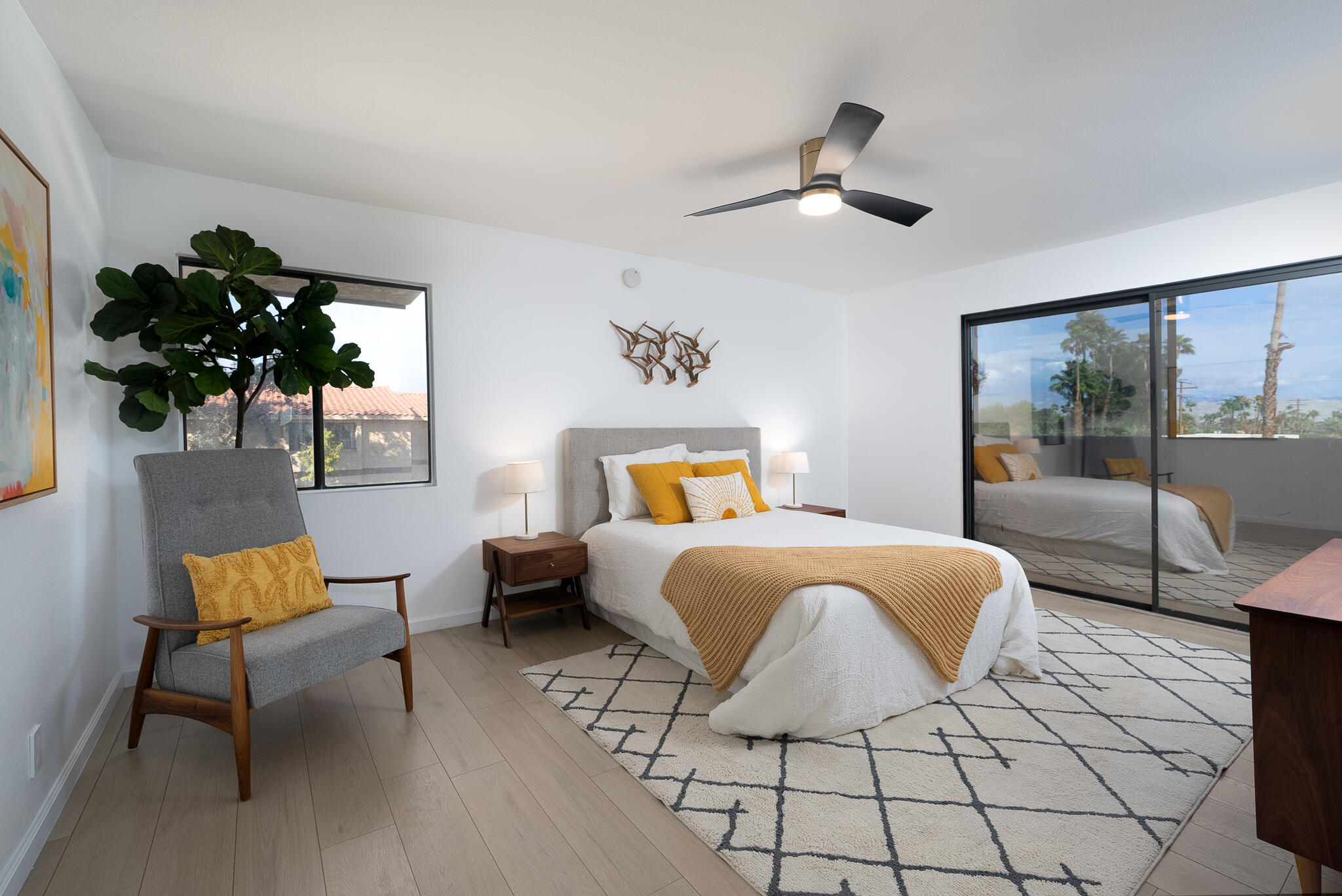 200 East Racquet Club Road, Unit 24 Palm Springs, CA 92262 - Photo 21 of 58 a bed room with a bed and a lamp
