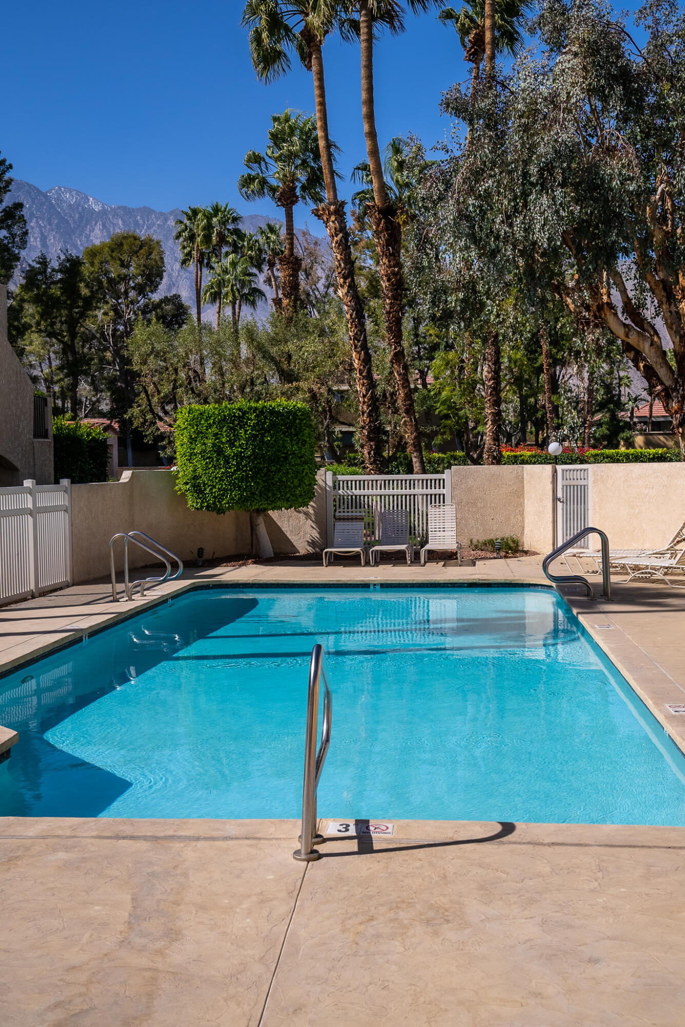 200 East Racquet Club Road, Unit 24 Palm Springs, CA 92262 - Photo 45 of 58 a view of a chairs and table in the patio