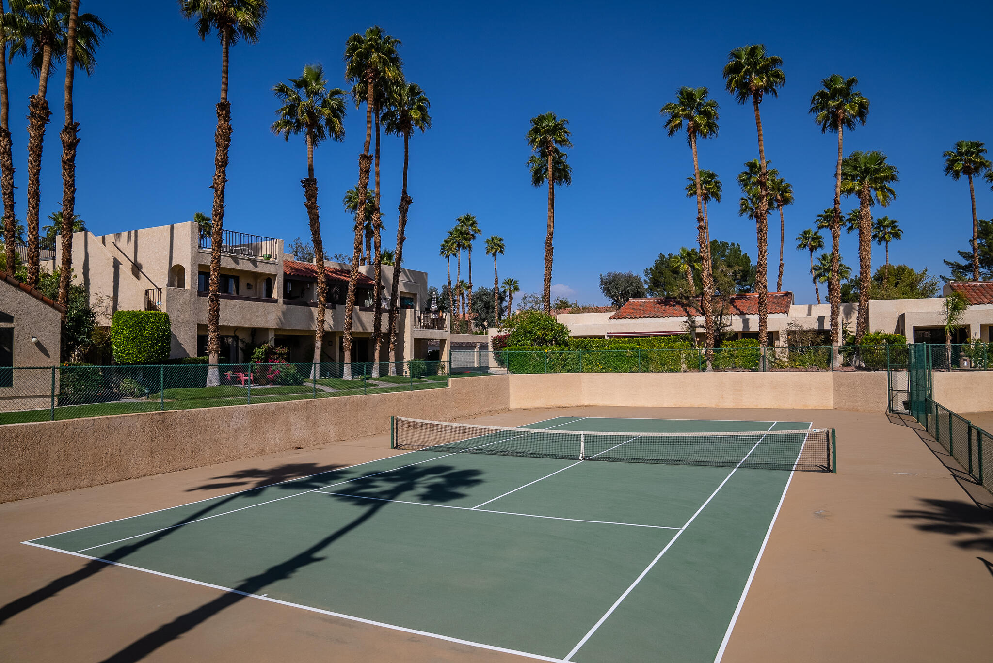 200 East Racquet Club Road, Unit 24 Palm Springs, CA 92262 - Photo 46 of 58 a view of a tennis court