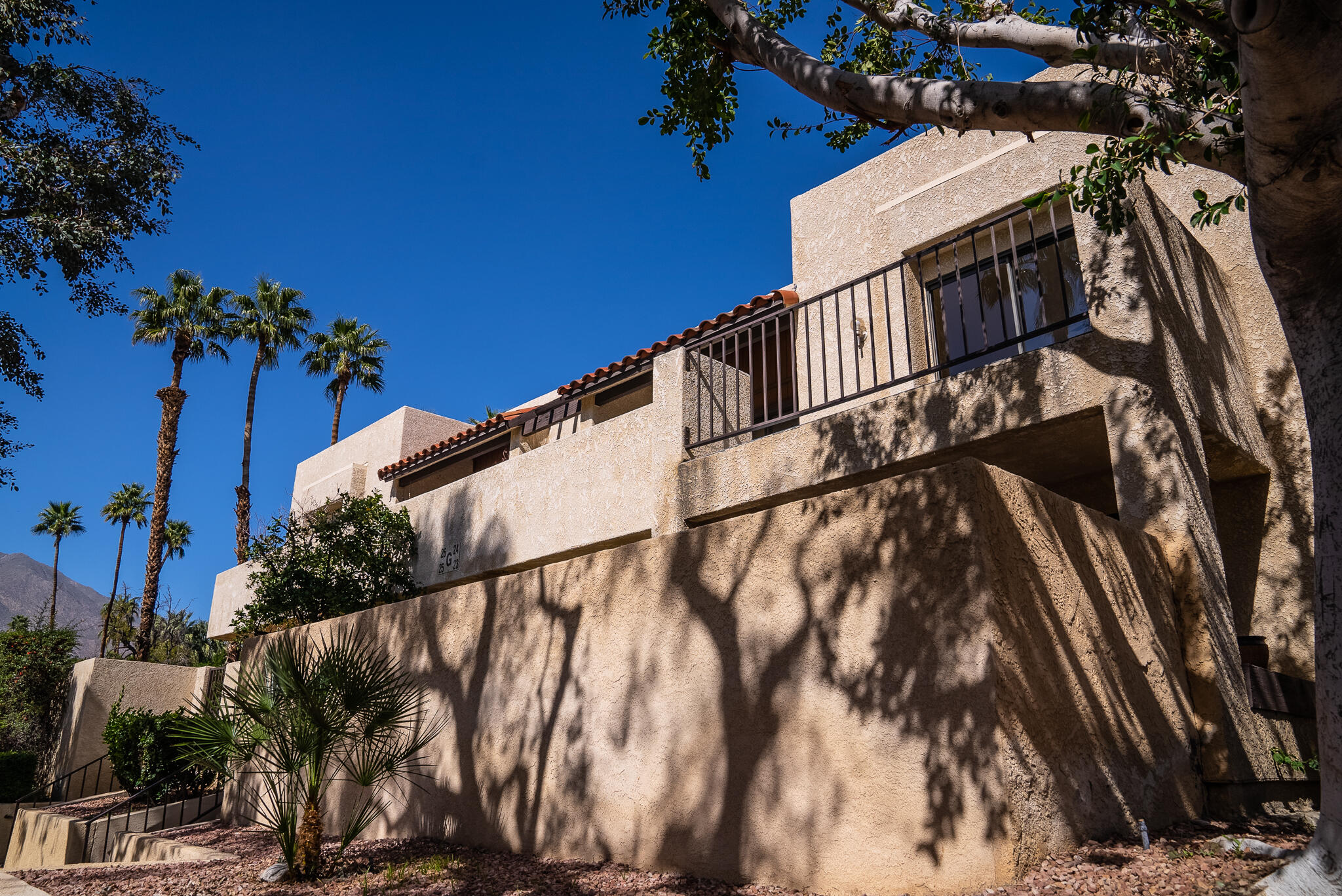 200 East Racquet Club Road, Unit 24 Palm Springs, CA 92262 - Photo 49 of 58 a view of a house with a street