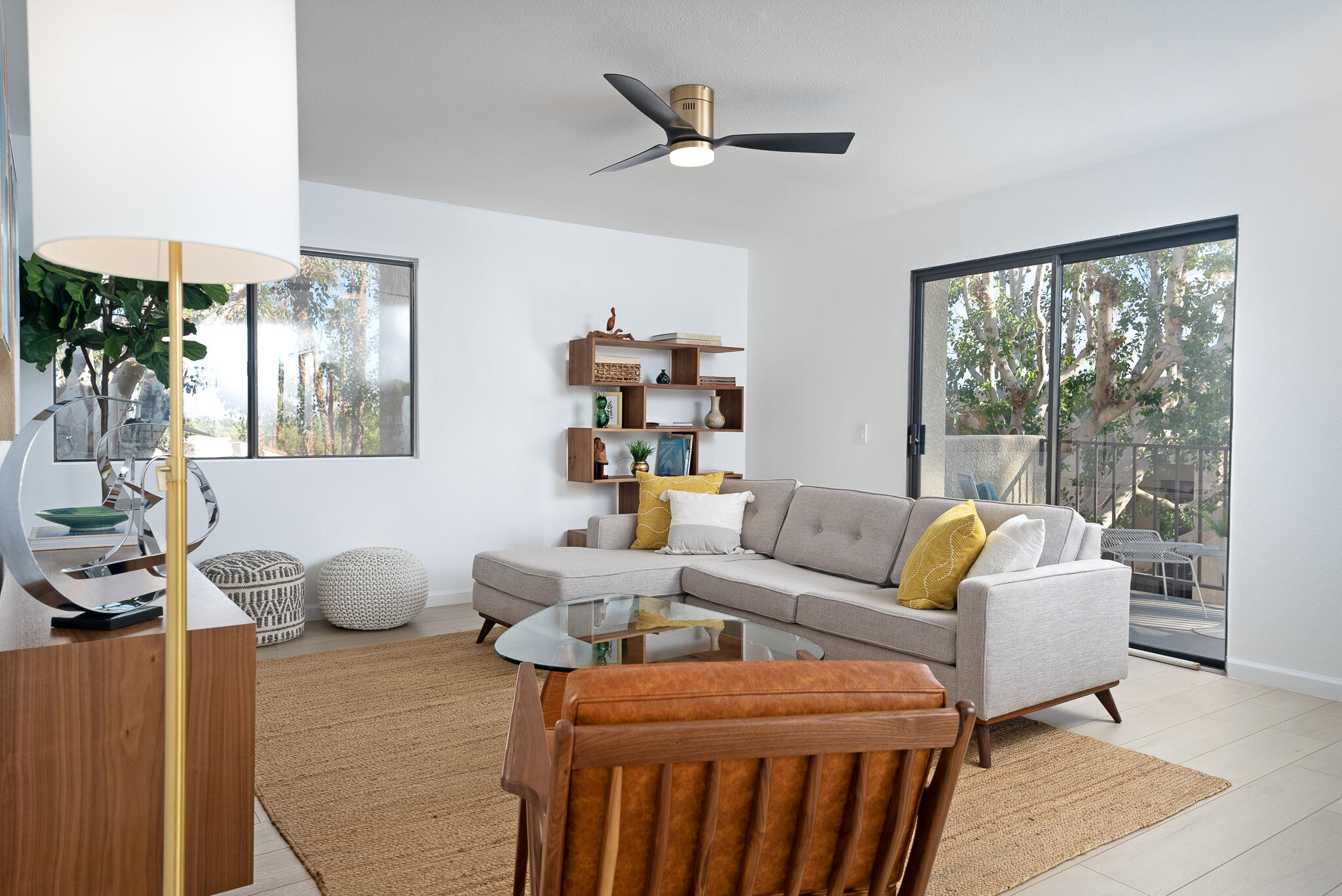 200 East Racquet Club Road, Unit 24 Palm Springs, CA 92262 - Photo 5 of 58 a living room with furniture a table and a large window