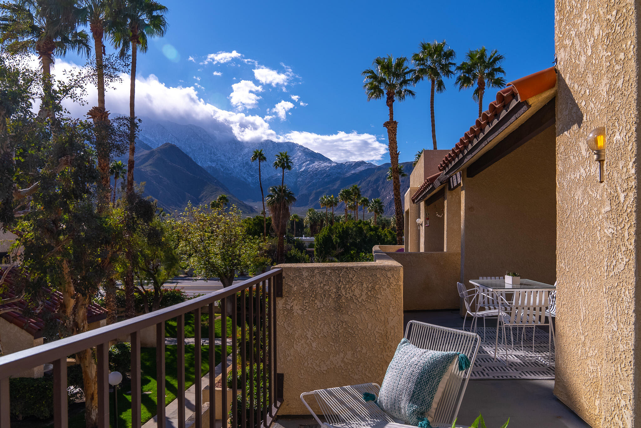 200 East Racquet Club Road, Unit 24 Palm Springs, CA 92262 - Photo 51 of 58 a view of a balcony with a potted plant