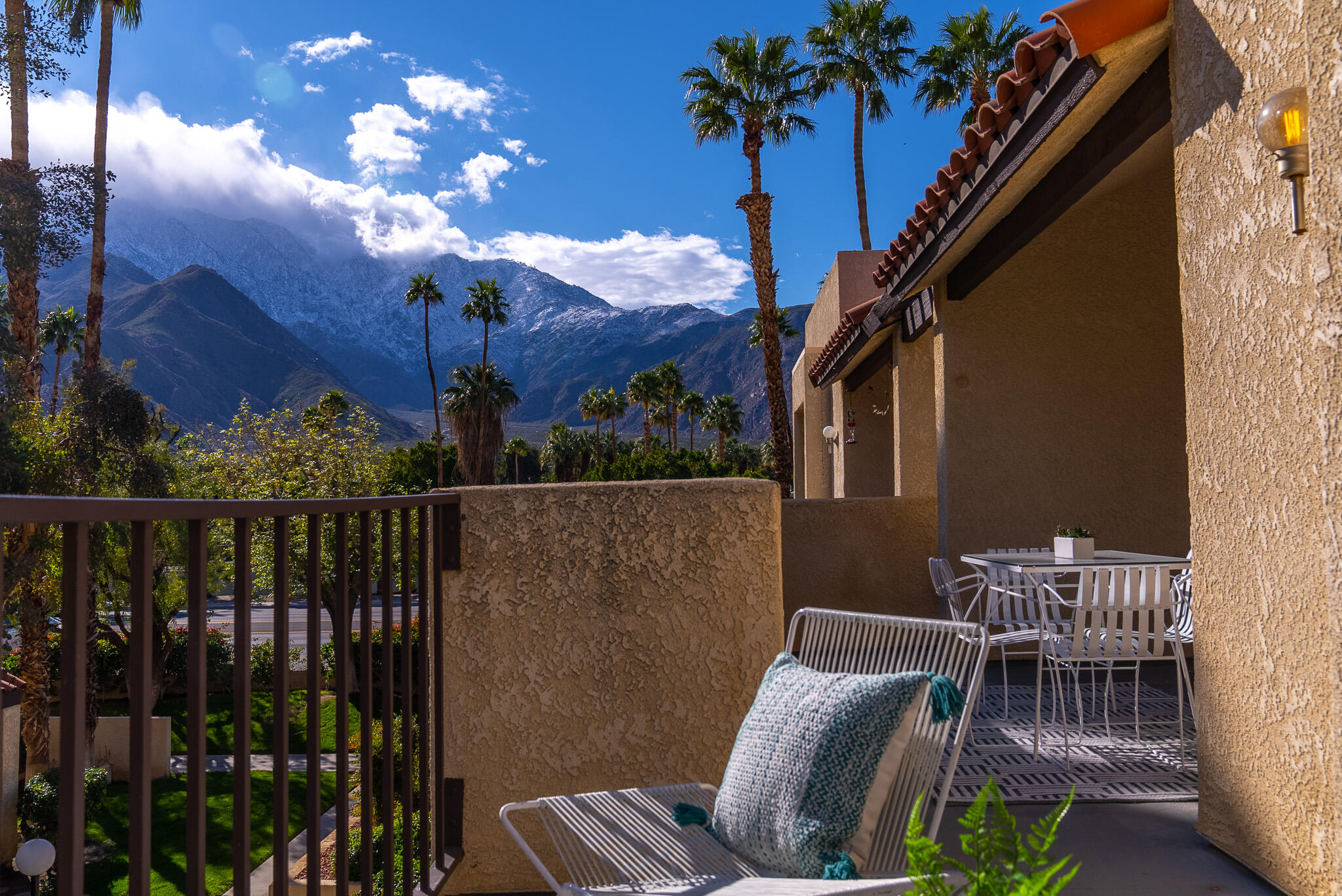 200 East Racquet Club Road, Unit 24 Palm Springs, CA 92262 - Photo 52 of 58 a view of balcony with furniture and potted plants