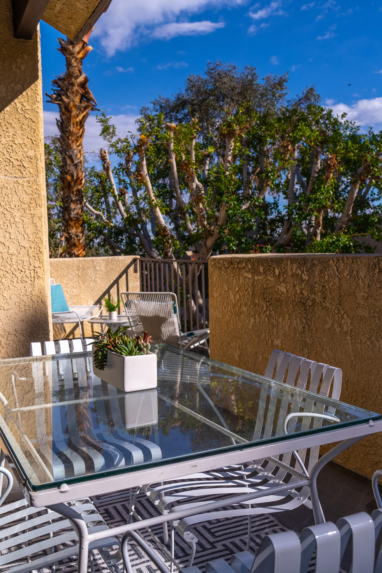 200 East Racquet Club Road, Unit 24 Palm Springs, CA 92262 - Photo 57 of 58 a view of balcony with two chairs and a table