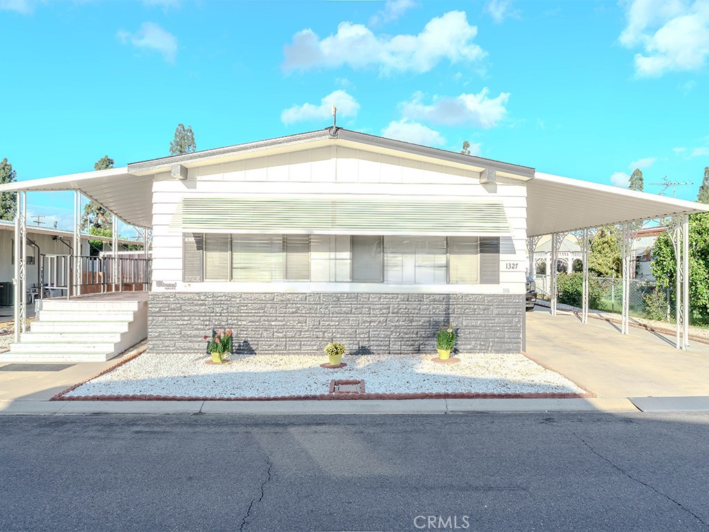 1327 Woodbrook Square Corona, CA 92882 - Photo 1 of 21 a view of house with outdoor space