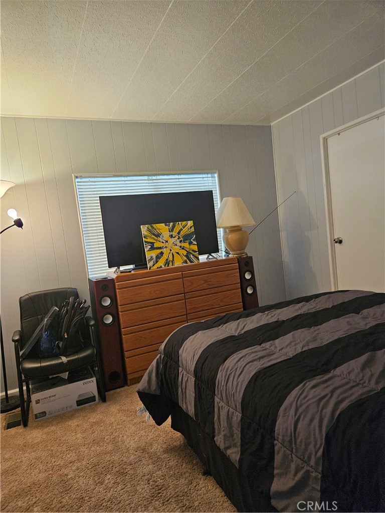 1327 Woodbrook Square Corona, CA 92882 - Photo 11 of 14 a bedroom with a bed and window