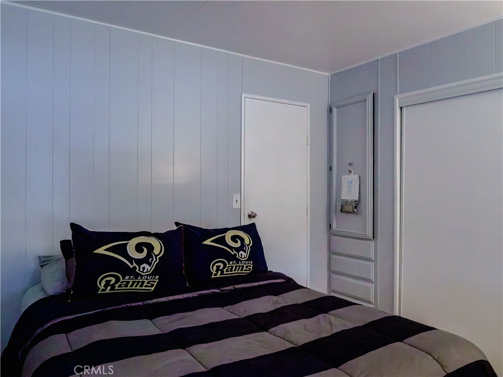 1327 Woodbrook Square Corona, CA 92882 - Photo 12 of 21 a view of a bedroom with a dresser