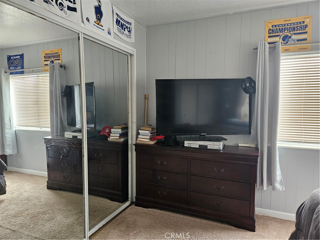 1327 Woodbrook Square Corona, CA 92882 - Photo 12 of 14 a room with furniture and flat screen tv