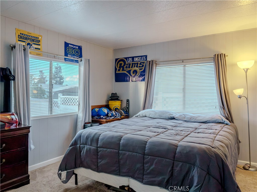 1327 Woodbrook Square Corona, CA 92882 - Photo 13 of 21 a bedroom with a bed and a window
