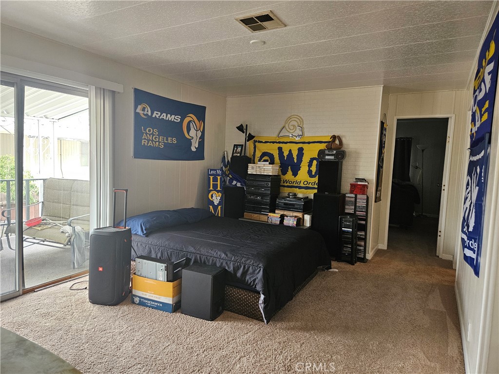 1327 Woodbrook Square Corona, CA 92882 - Photo 14 of 14 a bedroom with a bed and a large window