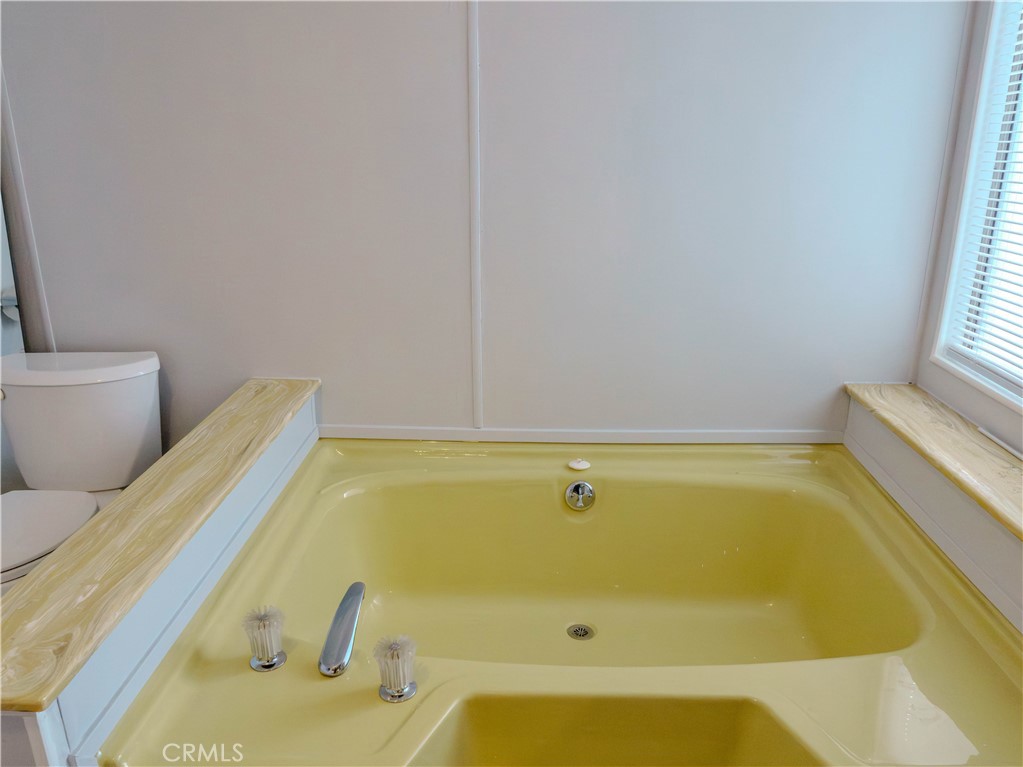 1327 Woodbrook Square Corona, CA 92882 - Photo 15 of 21 a bathroom with a sink and bathtub