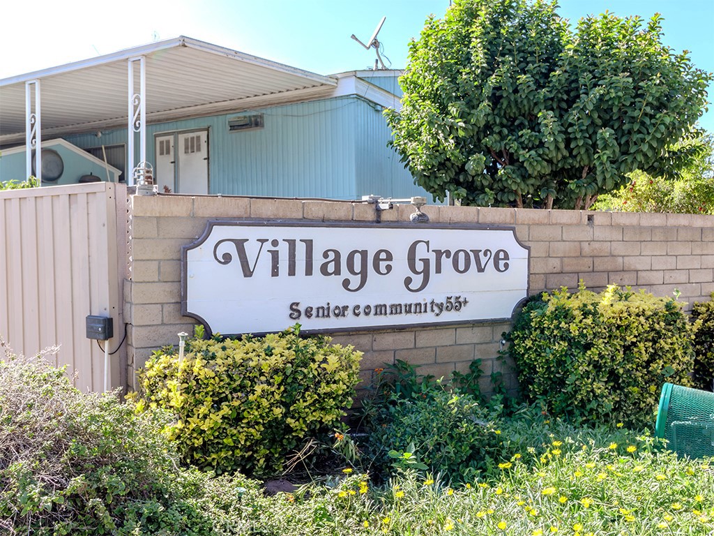 1327 Woodbrook Square Corona, CA 92882 - Photo 21 of 21 a sign on the side of a building