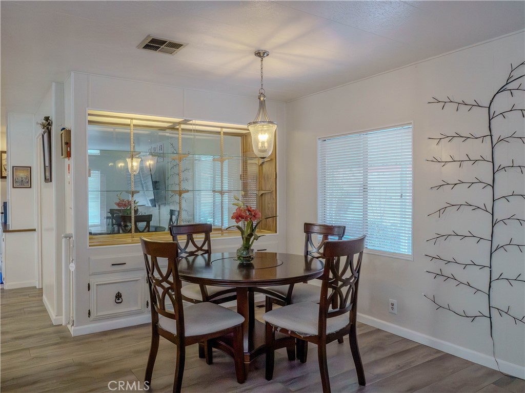 1327 Woodbrook Square Corona, CA 92882 - Photo 3 of 21 a dining room with furniture and window