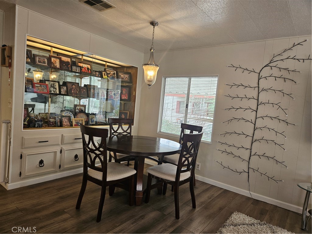 1327 Woodbrook Square Corona, CA 92882 - Photo 7 of 14 a dining room with furniture and window