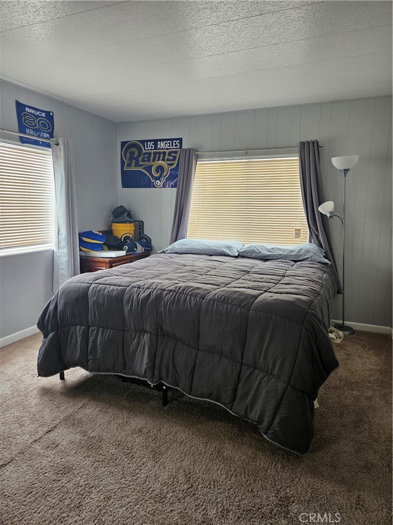 1327 Woodbrook Square Corona, CA 92882 - Photo 9 of 14 a bedroom with a bed a window and dresser