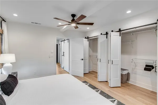 a bathroom with a toilet a sink and a mirror