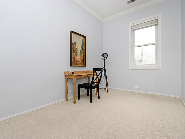 2730 North Racine Avenue, Unit 2S Chicago, IL 60614 - Photo 14 of 18 an empty room with windows and furniture
