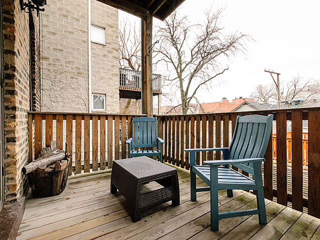2730 North Racine Avenue, Unit 2S Chicago, IL 60614 - Photo 16 of 18 a view of a wooden deck with a bench