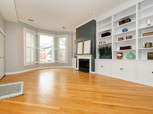 2730 North Racine Avenue, Unit 2S Chicago, IL 60614 - Photo 3 of 18 a view of an empty room with a fireplace and a window