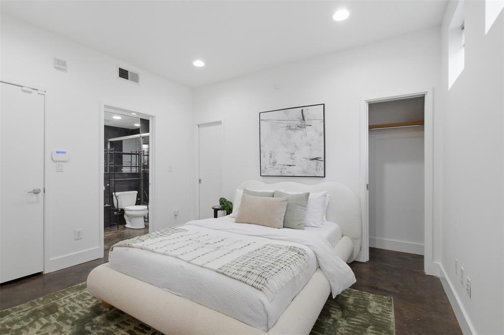 2111 Clark Street, Unit H Dallas, TX 75204 - Photo 3 of 37 a bedroom with a bed and a window