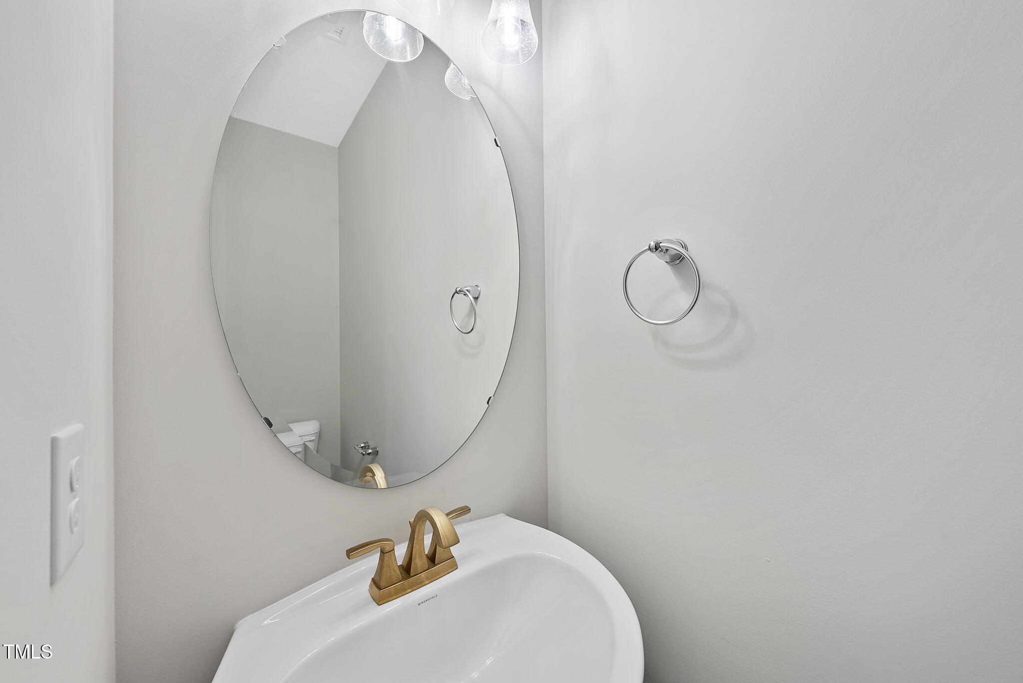 421 Como Drive Raleigh, NC 27610 - Photo 12 of 28 a bathroom with a sink and mirror