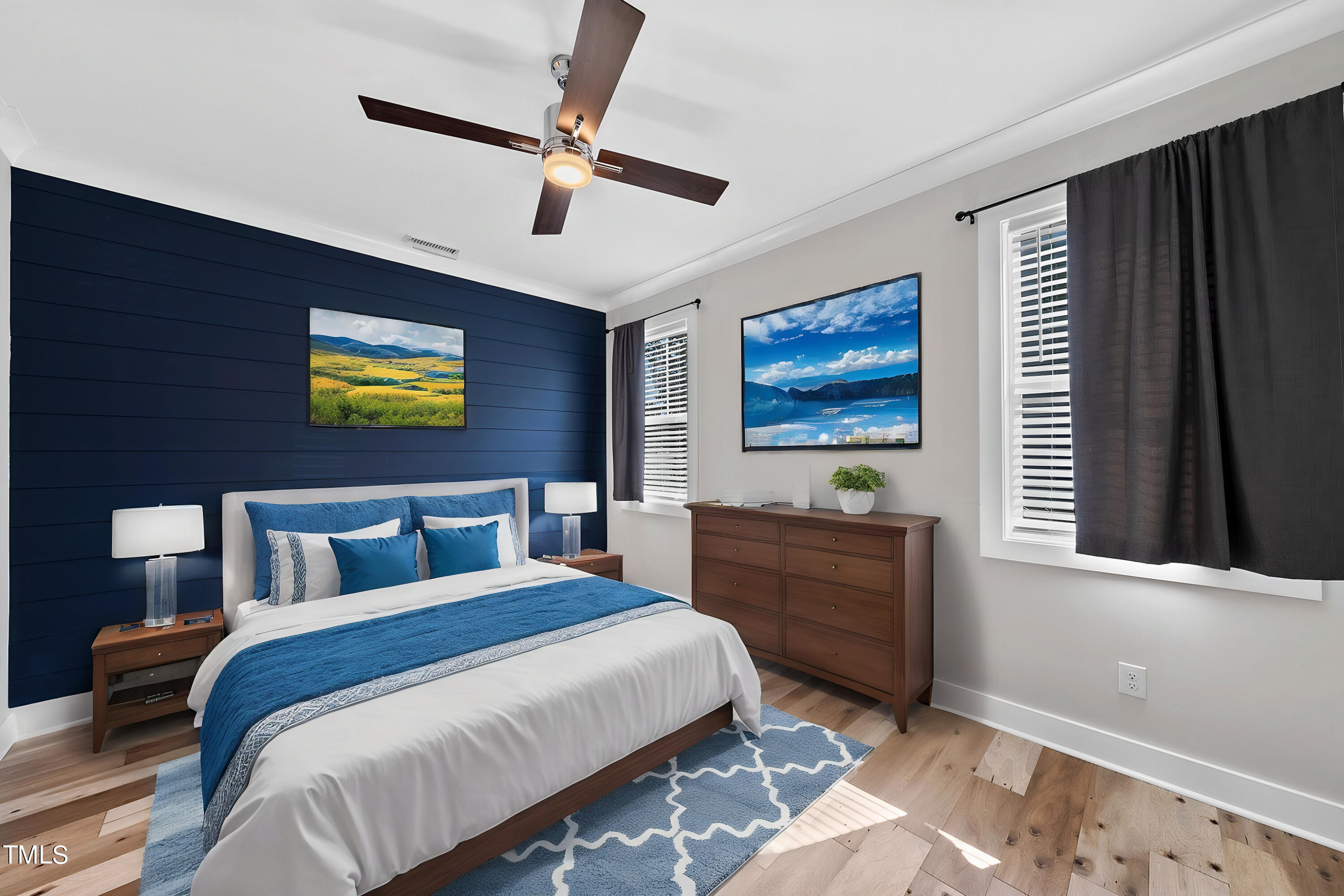 421 Como Drive Raleigh, NC 27610 - Photo 13 of 28 a bedroom with a bed and a chandelier