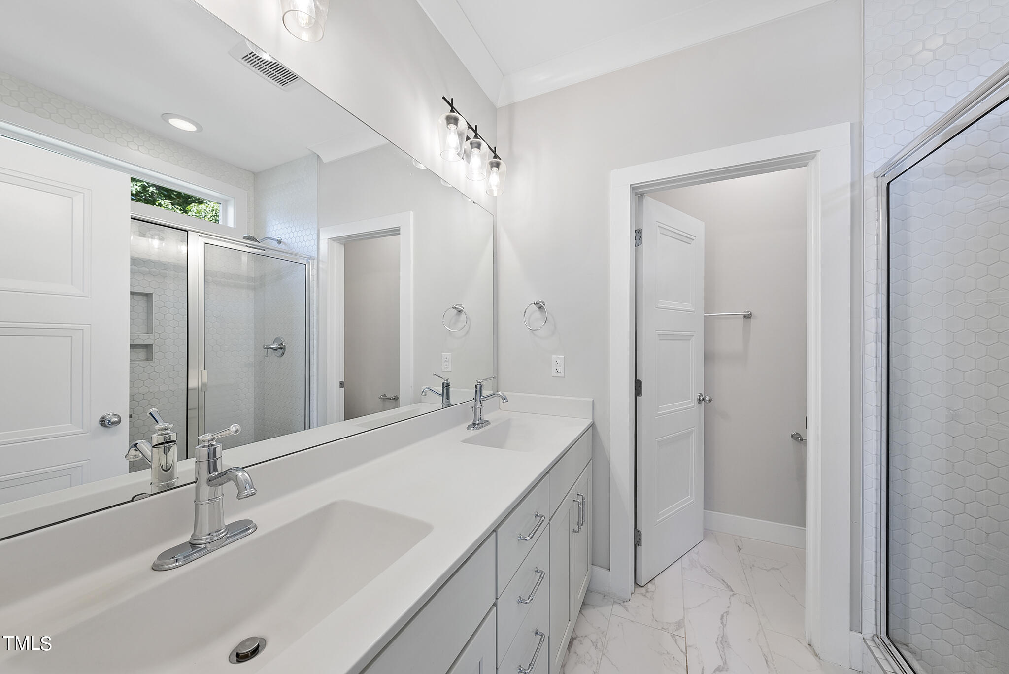 421 Como Drive Raleigh, NC 27610 - Photo 16 of 28 a bathroom with a double vanity sink mirror and double