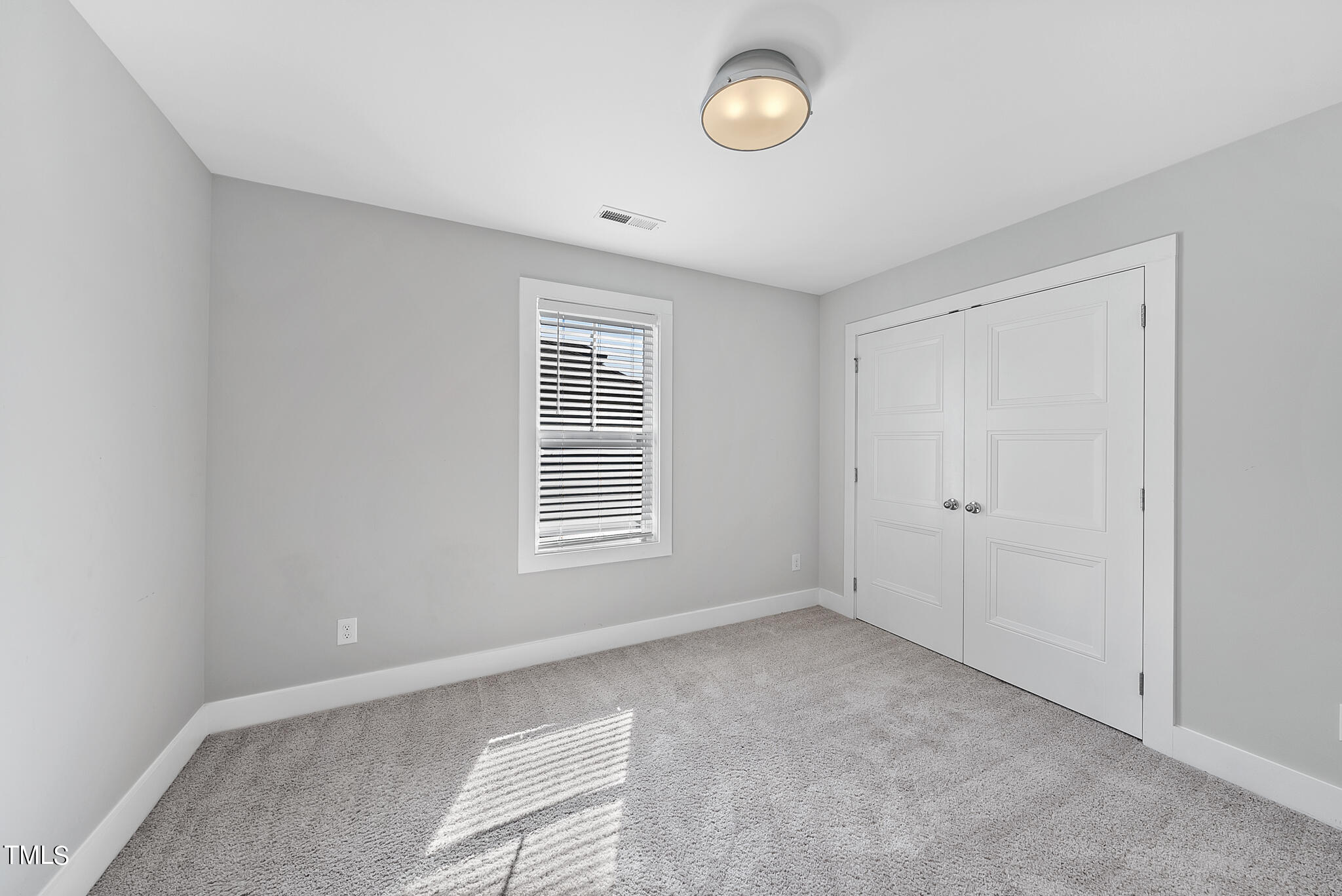 421 Como Drive Raleigh, NC 27610 - Photo 18 of 28 a view of an empty room with a window