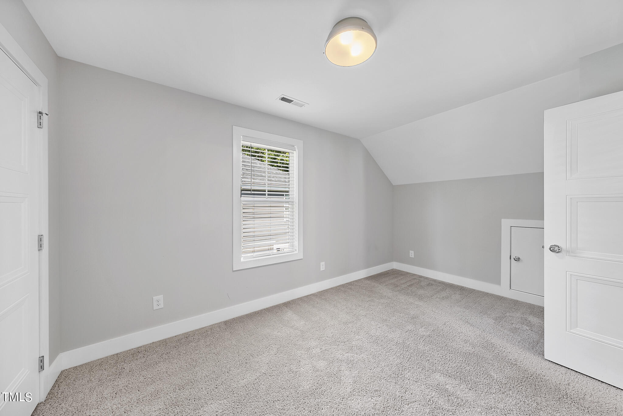 421 Como Drive Raleigh, NC 27610 - Photo 19 of 28 an empty room with windows