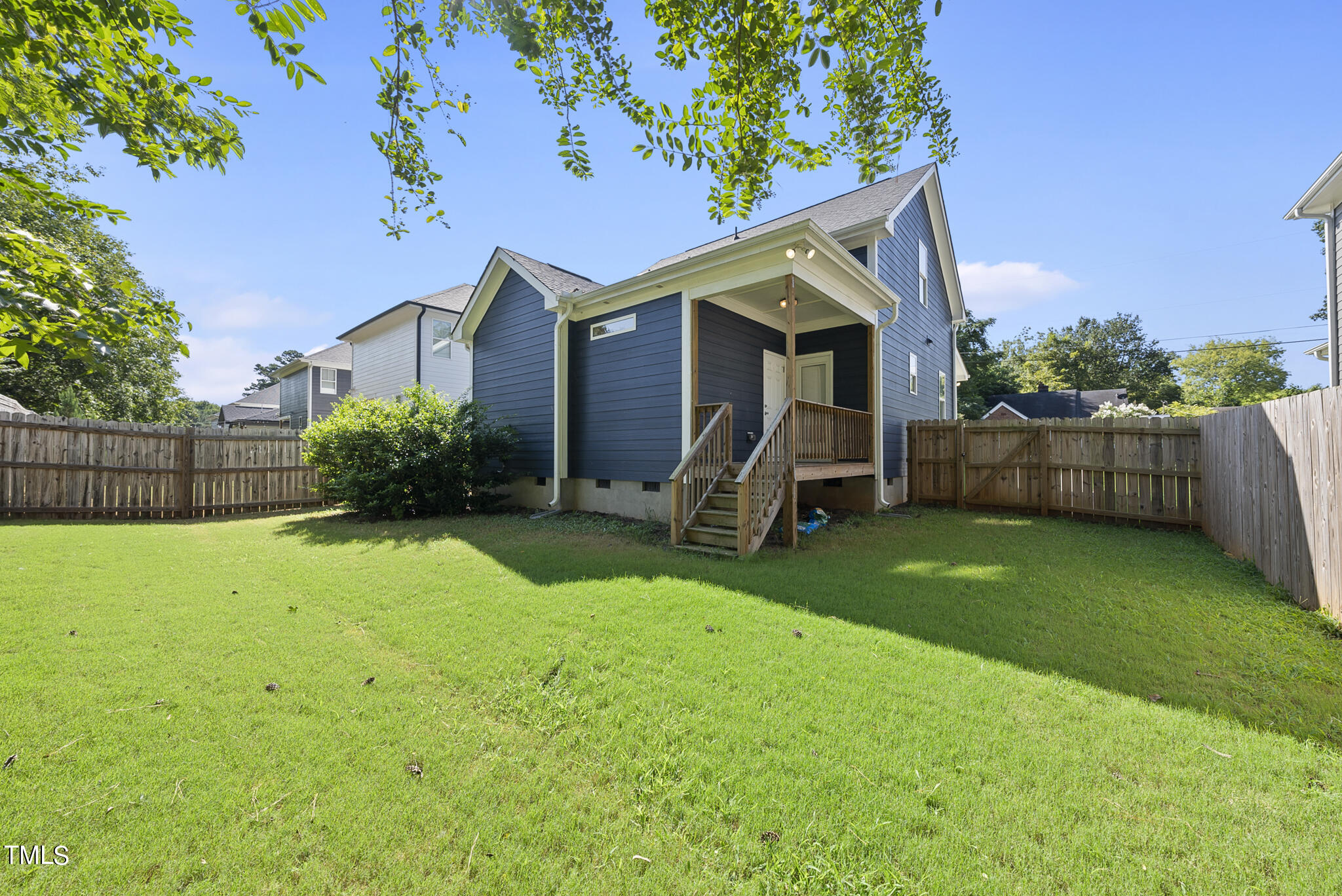 421 Como Drive Raleigh, NC 27610 - Photo 24 of 28 a view of a house with backyard and a tree