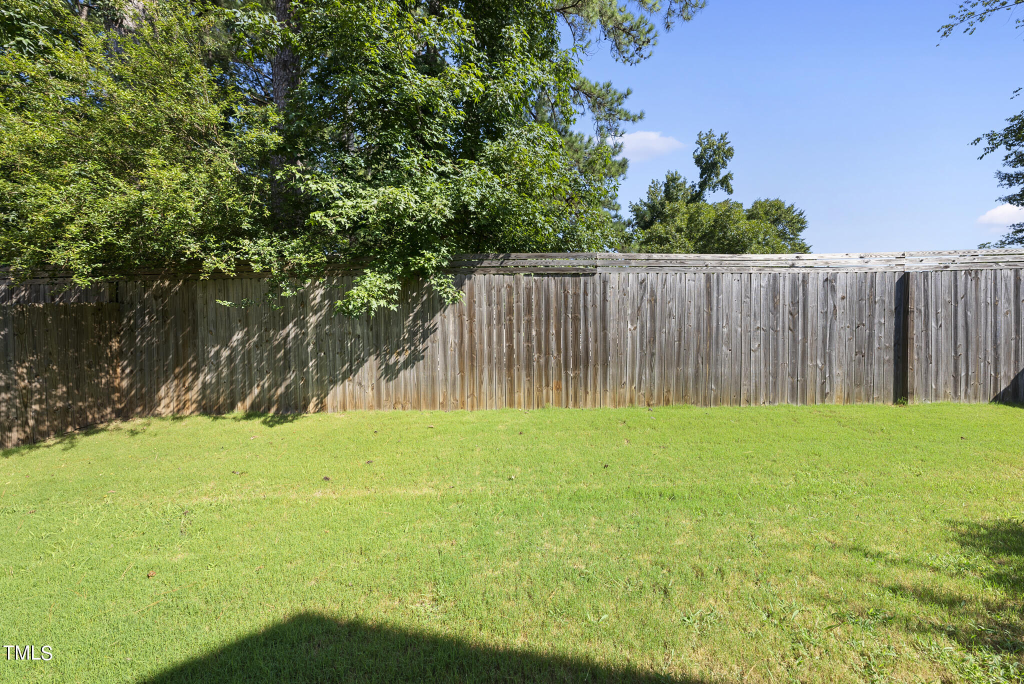 421 Como Drive Raleigh, NC 27610 - Photo 26 of 28 a view of backyard with wooden fence