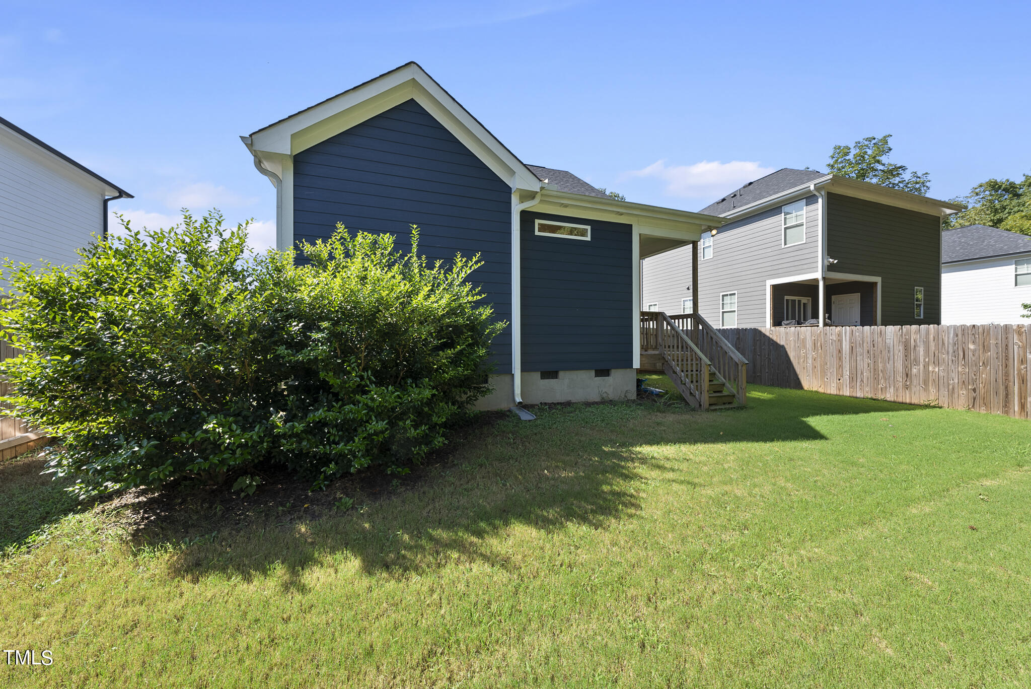 421 Como Drive Raleigh, NC 27610 - Photo 27 of 28 a view of backyard of house with green space