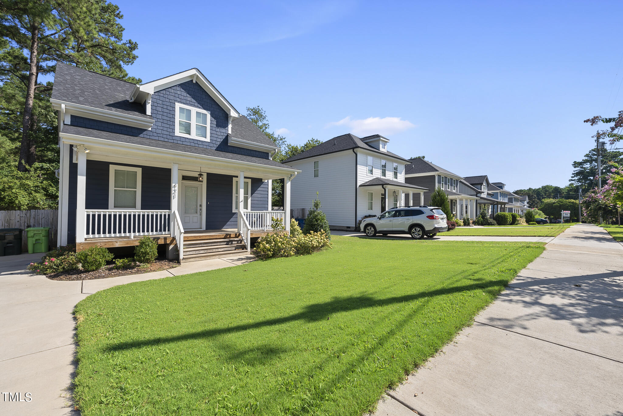 421 Como Drive Raleigh, NC 27610 - Photo 3 of 28 a front view of a house with a yard table and chairs