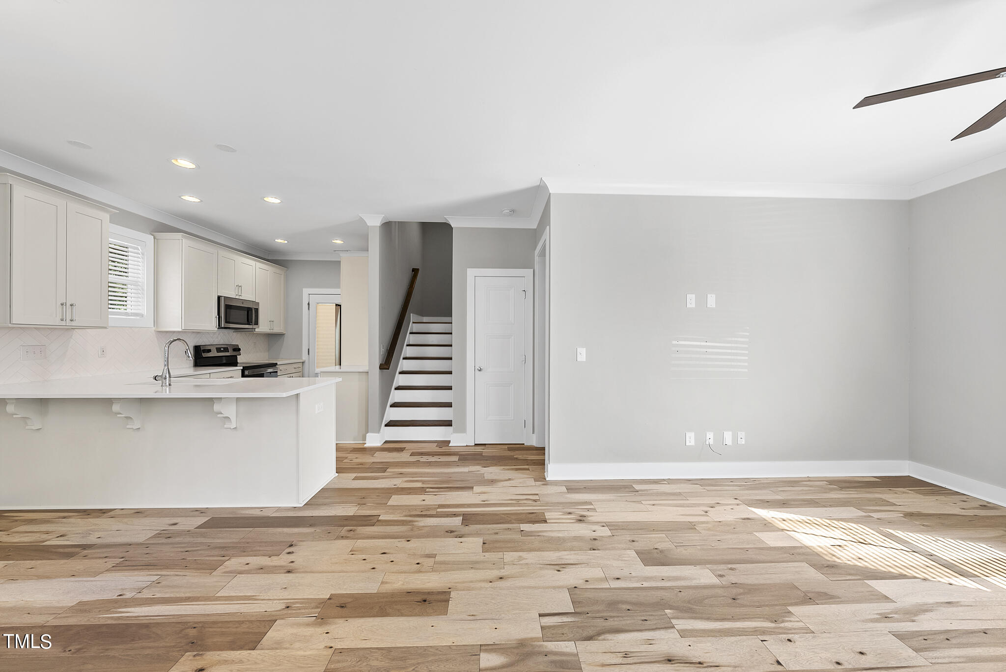 421 Como Drive Raleigh, NC 27610 - Photo 6 of 28 a view of kitchen with wooden floor and electronic appliances