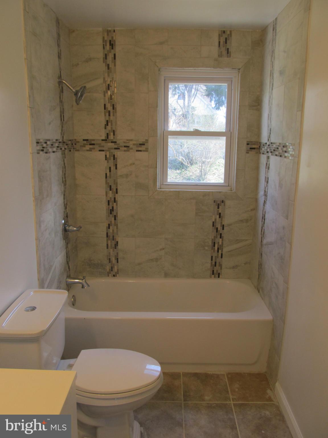 3507 Mayfair Road Baltimore, MD 21207 - Photo 9 of 30 a bathroom with a toilet and a bathtub