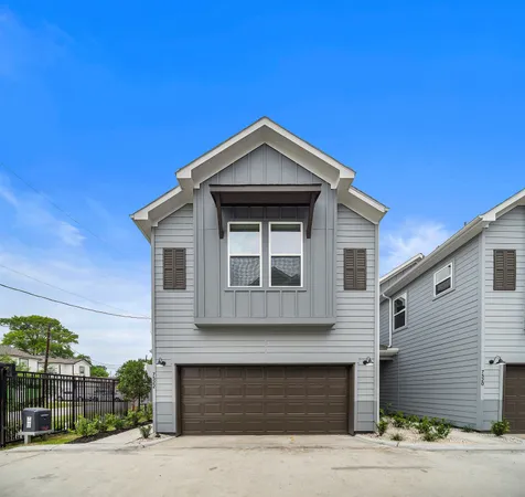 a front view of a house with garage
