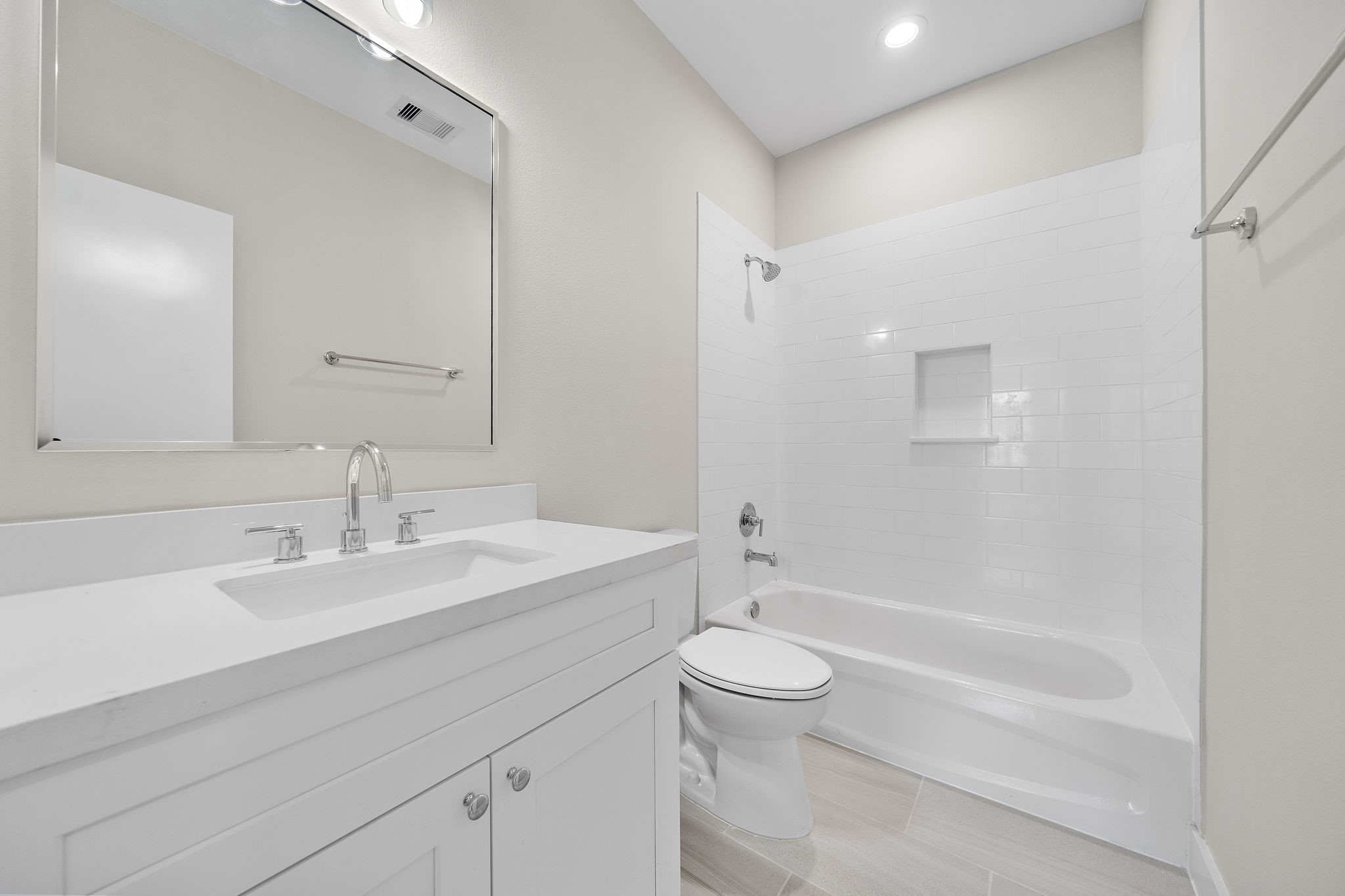 7522 Sandle Street Houston, TX 77088 - Photo 13 of 26 a bathroom with a sink a toilet and shower