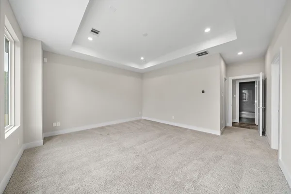 an empty room with a empty space and windows