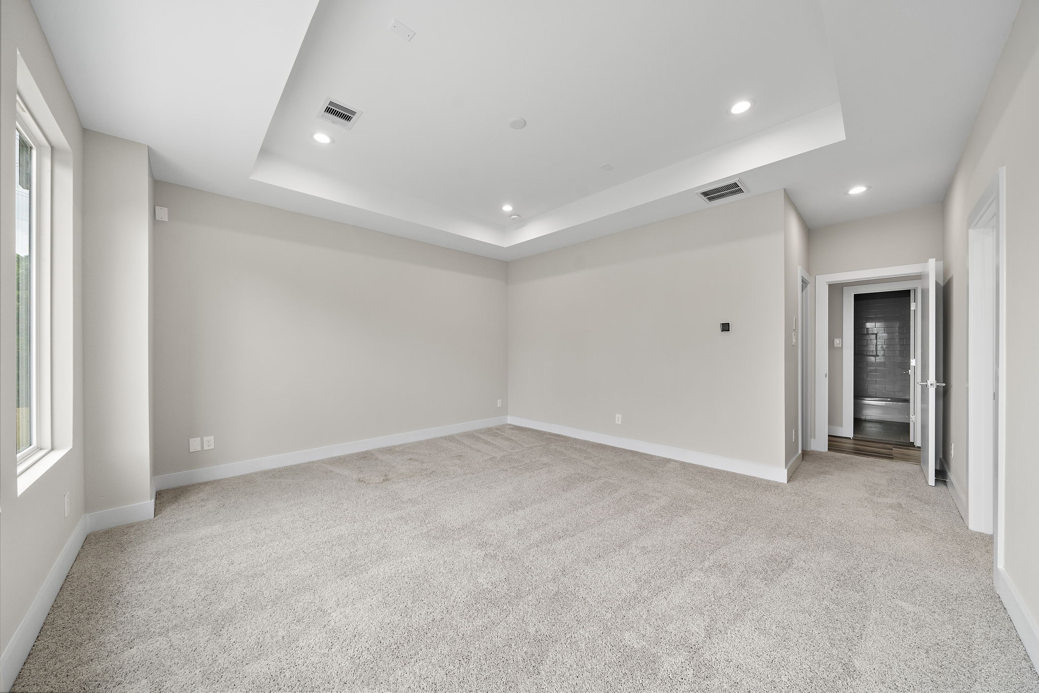 7522 Sandle Street Houston, TX 77088 - Photo 17 of 26 an empty room with a empty space and windows