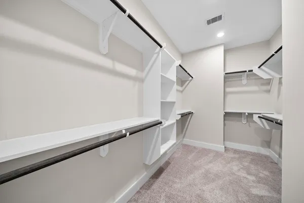 a view of an empty walk in closet