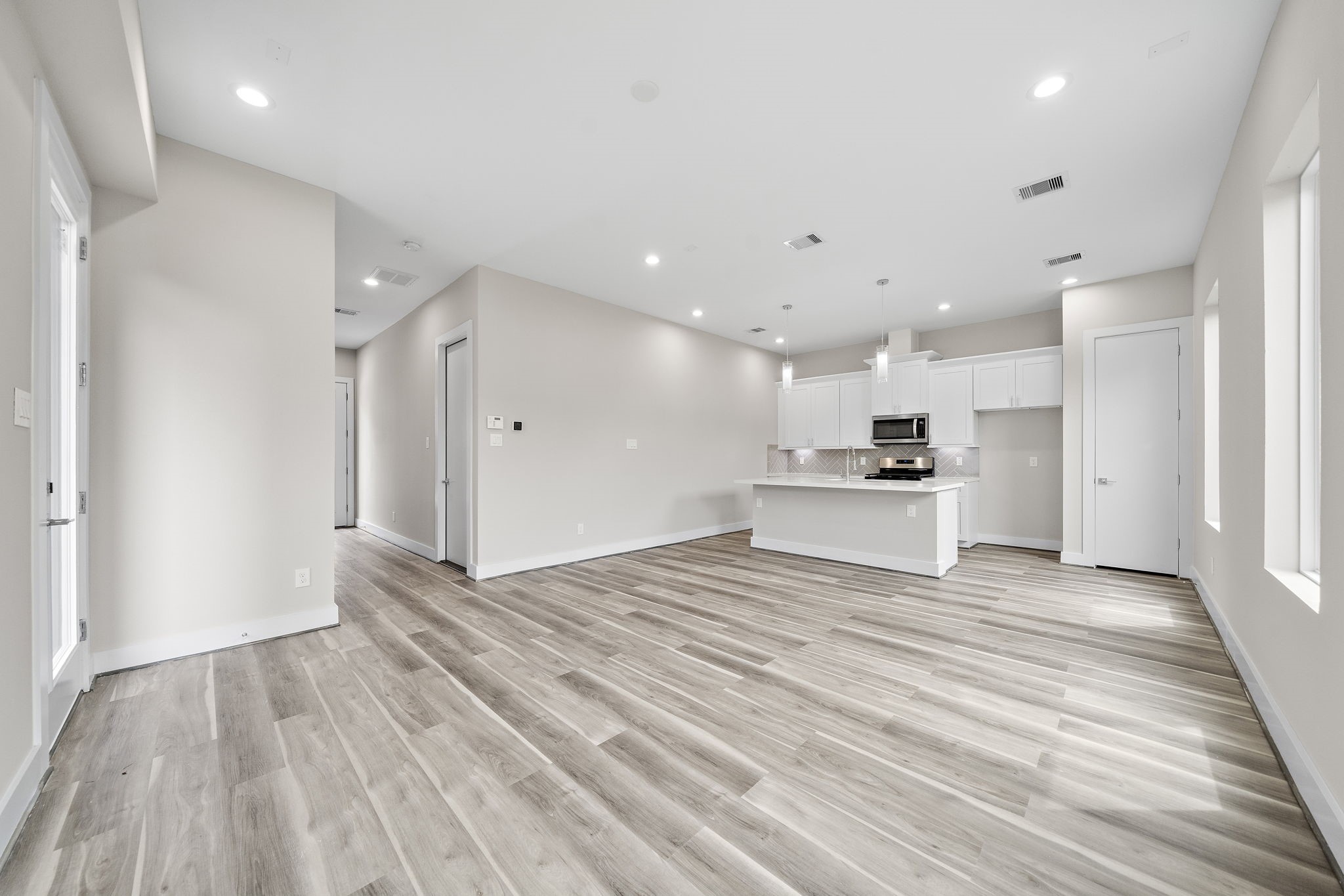 7522 Sandle Street Houston, TX 77088 - Photo 6 of 26 a view of an empty room with wooden floor