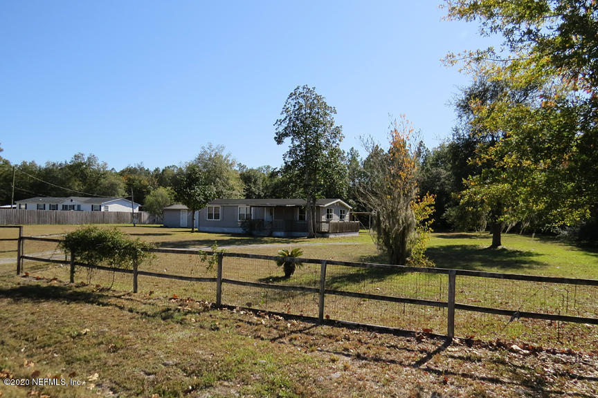 4075 Bronco Road Middleburg, FL 32068 - Photo 2 of 30 a view of a yard with wooden fence