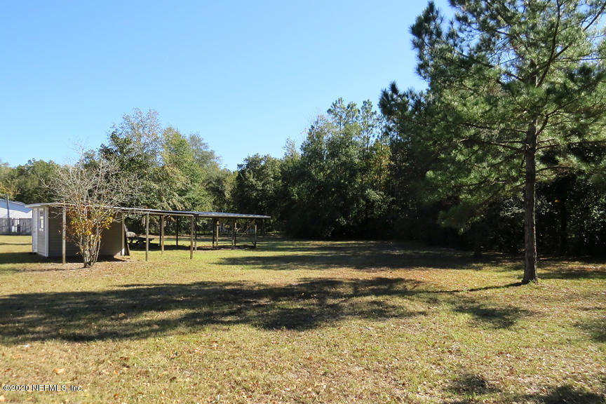 4075 Bronco Road Middleburg, FL 32068 - Photo 29 of 30 a view of a swimming pool with an outdoor space