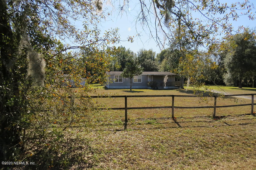 4075 Bronco Road Middleburg, FL 32068 - Photo 3 of 30 a view of a bench in a yard