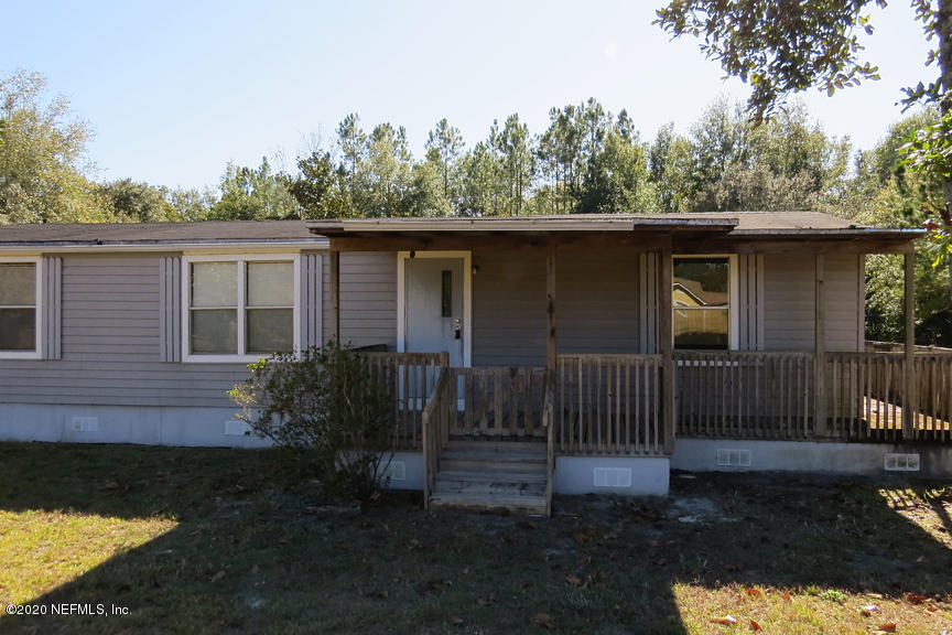 4075 Bronco Road Middleburg, FL 32068 - Photo 5 of 30 a house view with a garden space